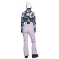 Back view of lavender Rojo softshell high rise ski pants for women with black suspenders and a high-waisted fit.
