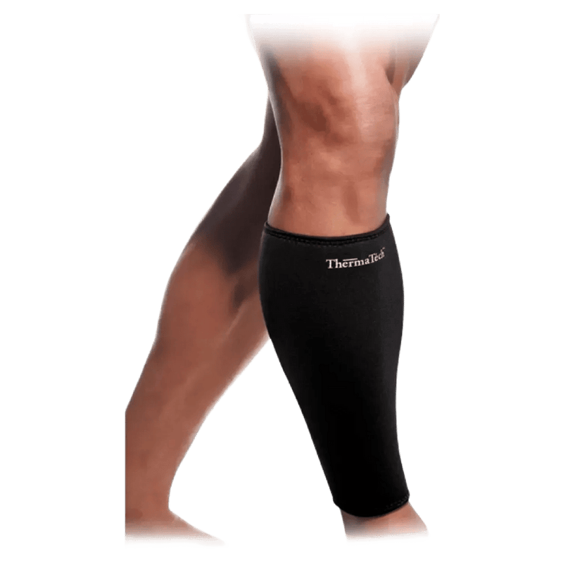 Black Therma Tech calf compression sleeve with white logo worn on a person's lower leg.