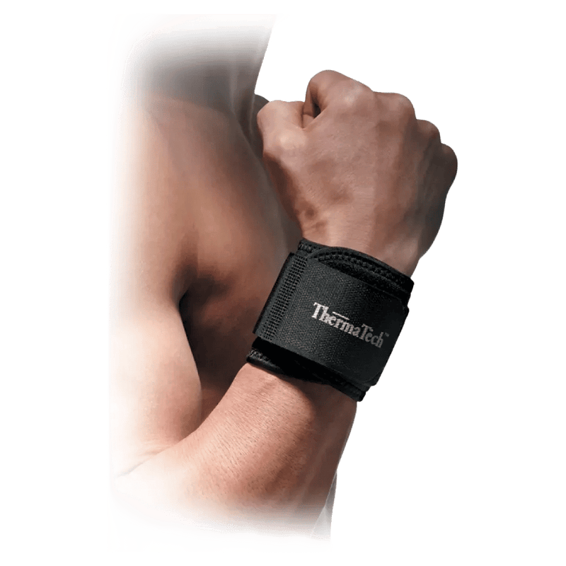 Black ThermaTech adjustable wrist support wrap worn on a person's wrist with a clenched fist.