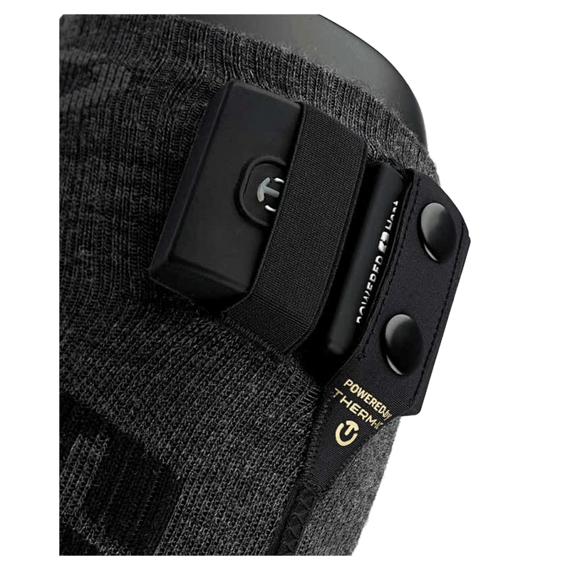 Dark grey knee-high heated sock with textured patterns and two black Therm-ic S-Pack 1400 battery packs.