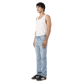 Side view of man in the Rollas Tim Slims Bad Boy Boogie Jeans in colour Mid Blue