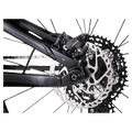 2023 Trek Fuel EX 8 Gen 6 mountain bike with a grey to black gradient frame, full suspension, and knobby tires.