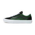 Dark green and black Vans Old Skool shoe with white laces and a thick white rubber sole, side profile view.