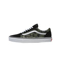 Side profile of a Vans Old Skool shoe featuring green camo print, black suede, white side stripe, and white midsole.