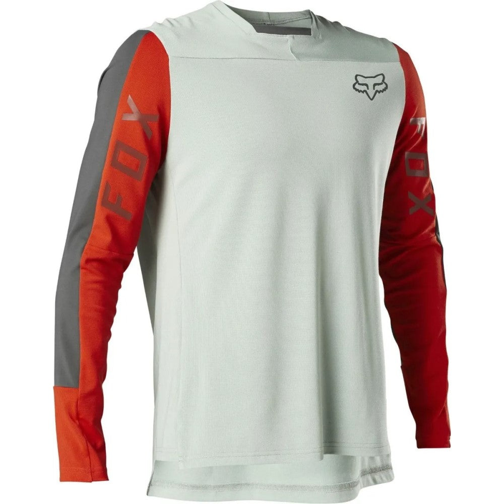 Long-sleeve mountain bike jersey in light green with red and grey sleeves.