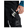 Detail view of a man wearing the Burton AK Cyclic Gore-Tex 2L Snowboard Pants in Black