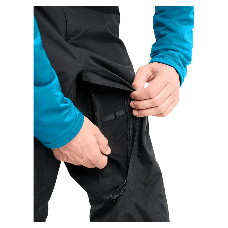 Detail view of a man wearing the Burton AK Cyclic Gore-Tex 2L Snowboard Pants in Black