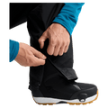 Detail view of a man wearing the Burton AK Cyclic Gore-Tex 2L Snowboard Pants in Black