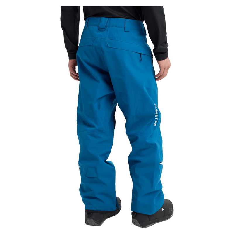 Rear view of a man wearing the Burton AK Cyclic Gore-Tex 2L Snowboard Pants in Blue Teal