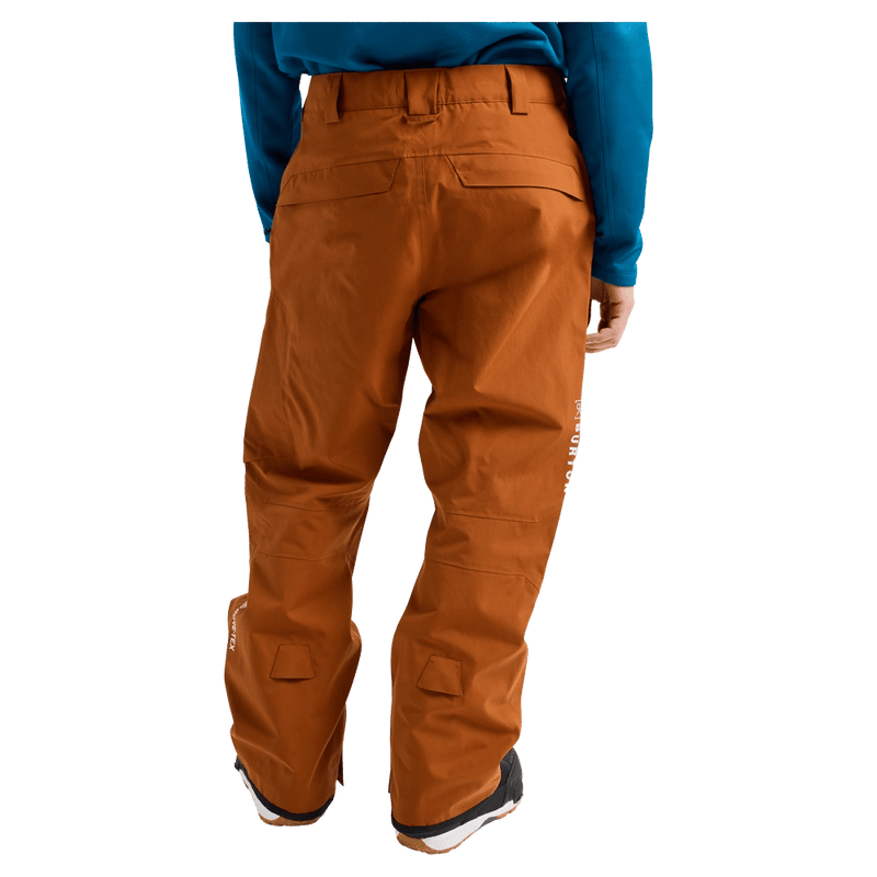 Rear view of a man wearing the Burton AK Cyclic Gore-Tex 2L Snowboard Pants in Chestnut Brown
