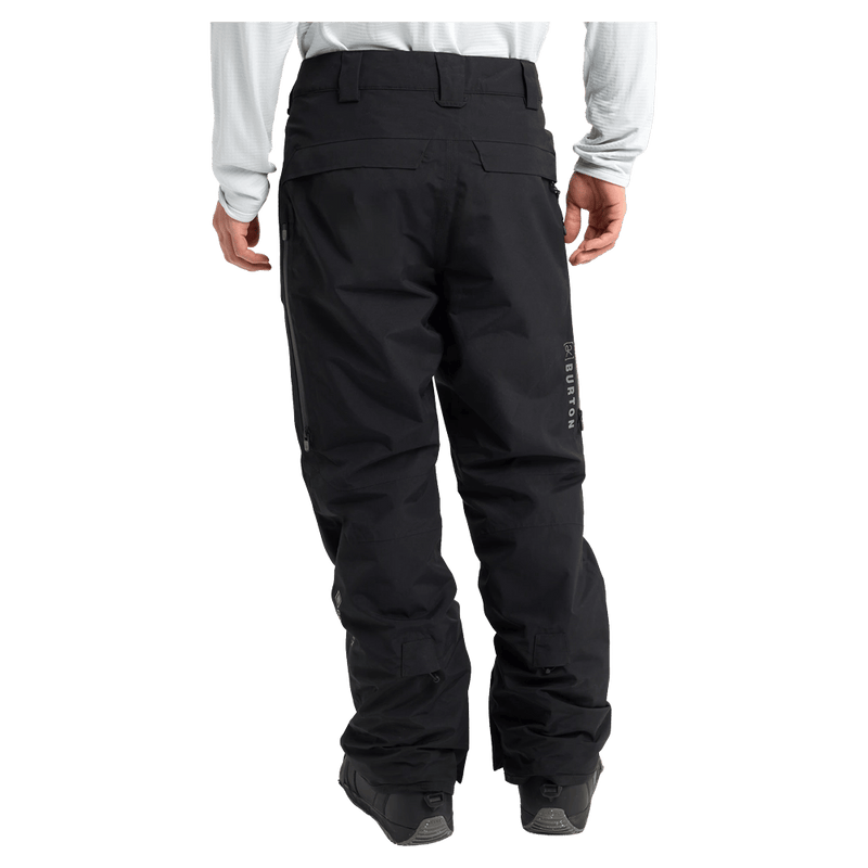 Rear cropped view of a man wearing the  Burton AK Swash Gore-Tex 2L Snowboard Pants in black