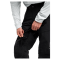Detailed cropped view of a man wearing the  Burton AK Swash Gore-Tex 2L Snowboard Pants in black