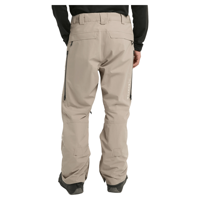 Rear cropped view of a man wearing the  Burton AK Swash Gore-Tex 2L Snowboard Pants in summit taupe
