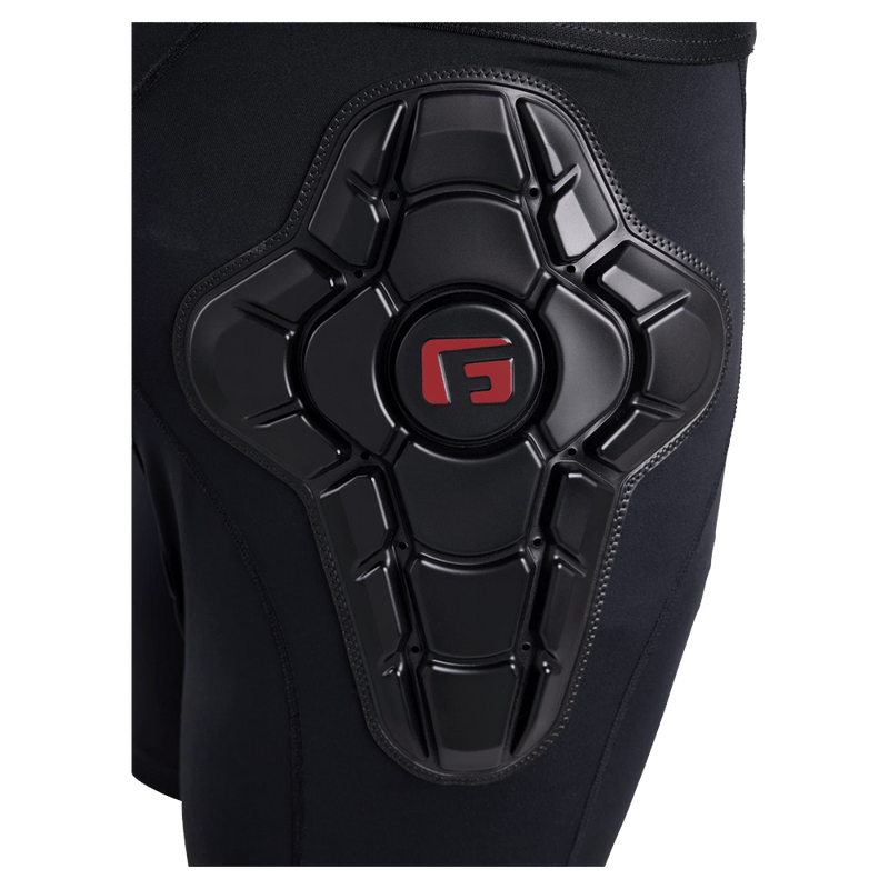 Close-up of black Burton Total Impact Shorts featuring an articulated G-Form protective hip pad with a red logo.
