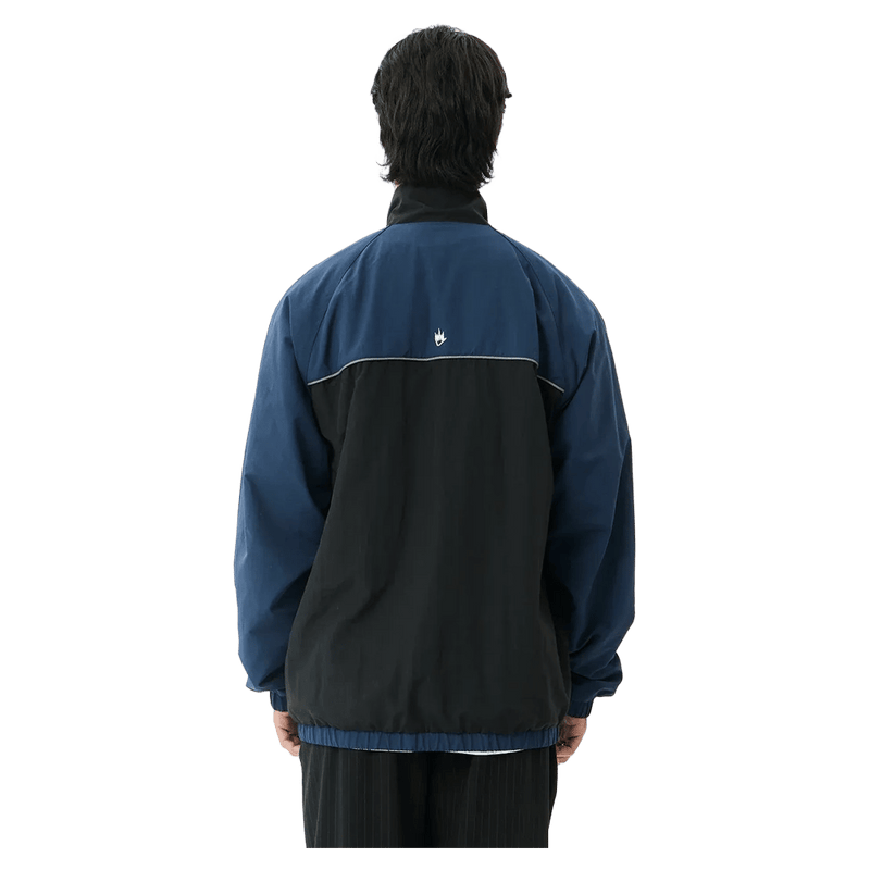 Back view of Afends Speed Recycled Sports Spray Jacket in colour Navy.