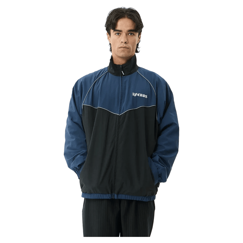 Front view of Afends Speed Recycled Sports Spray Jacket in colour Navy.