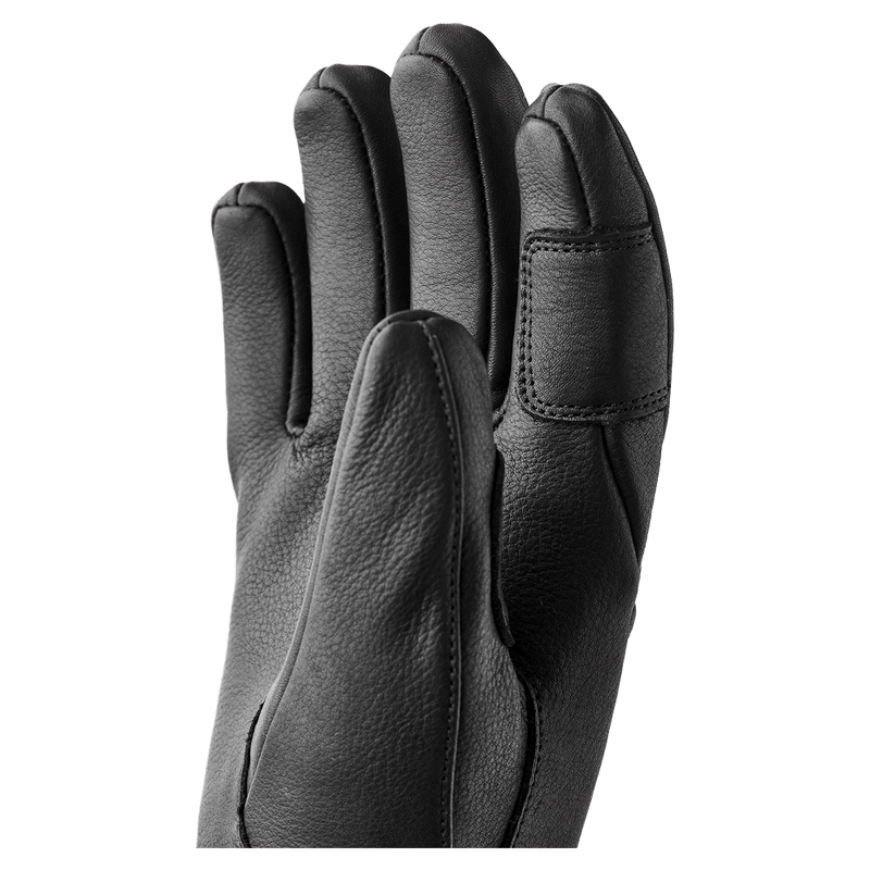 Hestra black leather Fall Line 5 finger glove for women showing the textured palm and stitched finger details in colour Black