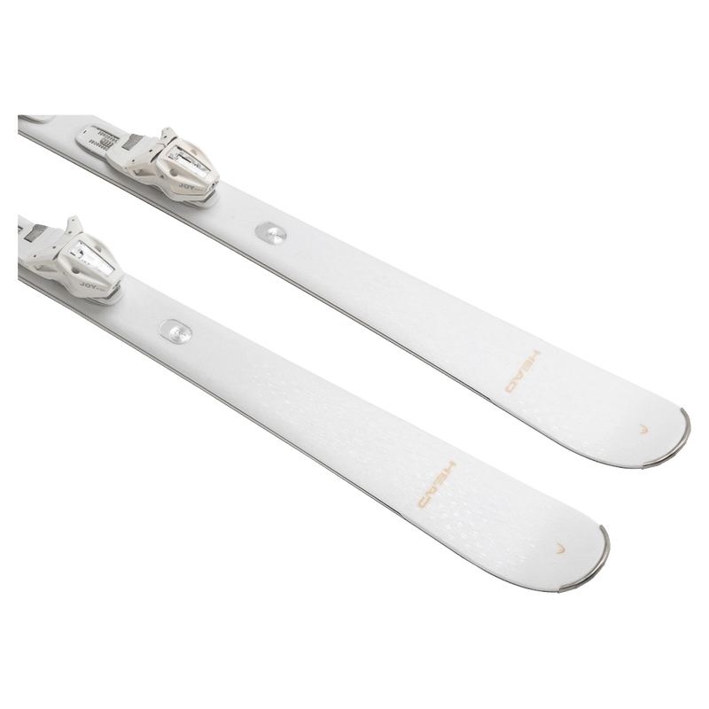 White Head e-Absolute Joy skis with matching white bindings, top-down diagonal view showing tips on a black background.