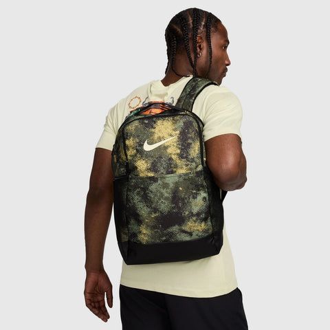 Cropped lifestyle image of the Brasilia Backpack in Oil Green Multi