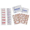 Contents laid out of the Adventure Medical Blister Kit showing blister packs, glacier gell dressing, antiseptic wipes.
