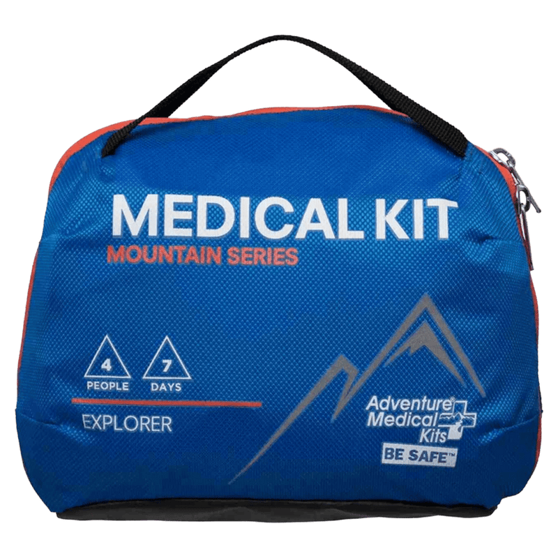 Front view of the Adventure Medical Kits Explorer First Aid Kit in Blue with black strap, white and orange writing and mountain logo
