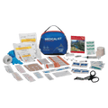Adventure Medical Backpacker Kit showing all the contents laid out. Zissors, medications, wound care, blister care, safety pins, manual, tape, gloves, sanitary wipes etc.
