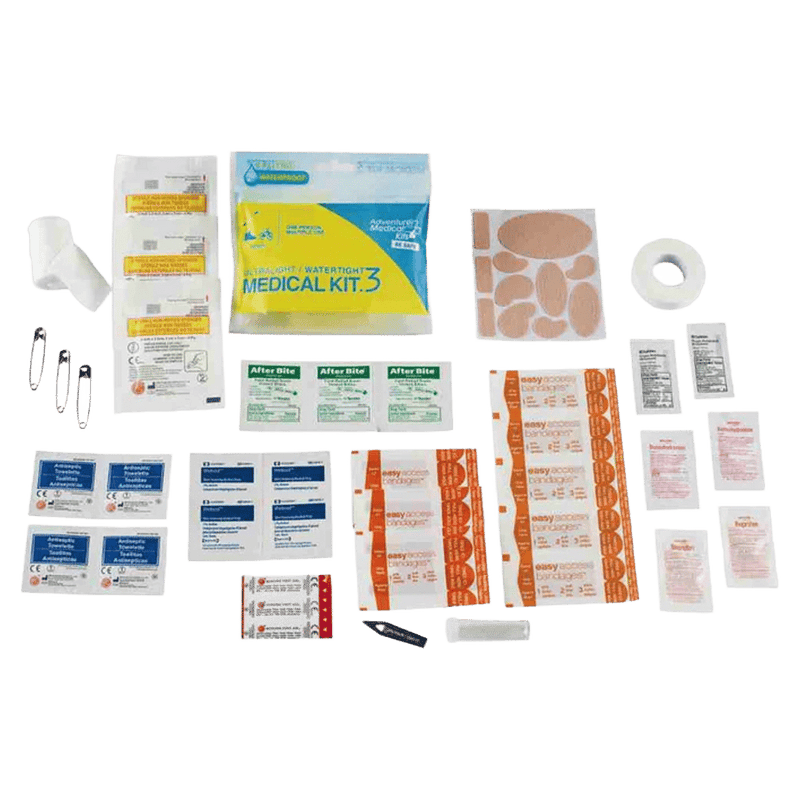 Contents displayed of the Adventure Medical Ultralight First Aid Kit .3 showing bandages, guaze, tape, blister care, alcohol swipes etc.