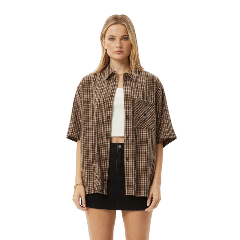 Woman wearing Afends Hometown Short Sleeve Shirt in coffee colorway