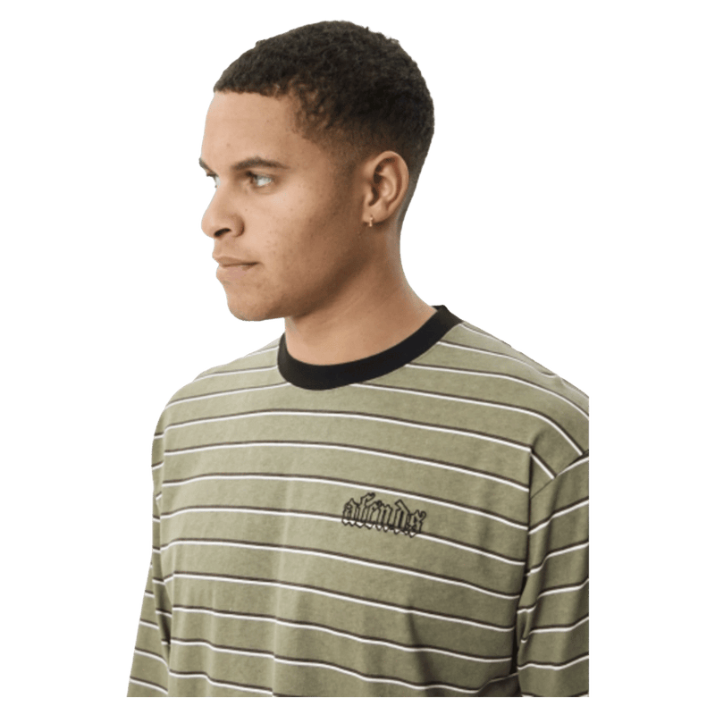 Close view of Afends Altitude Recycled Boxy Long Sleeve Tee in colour Stone Stripe.