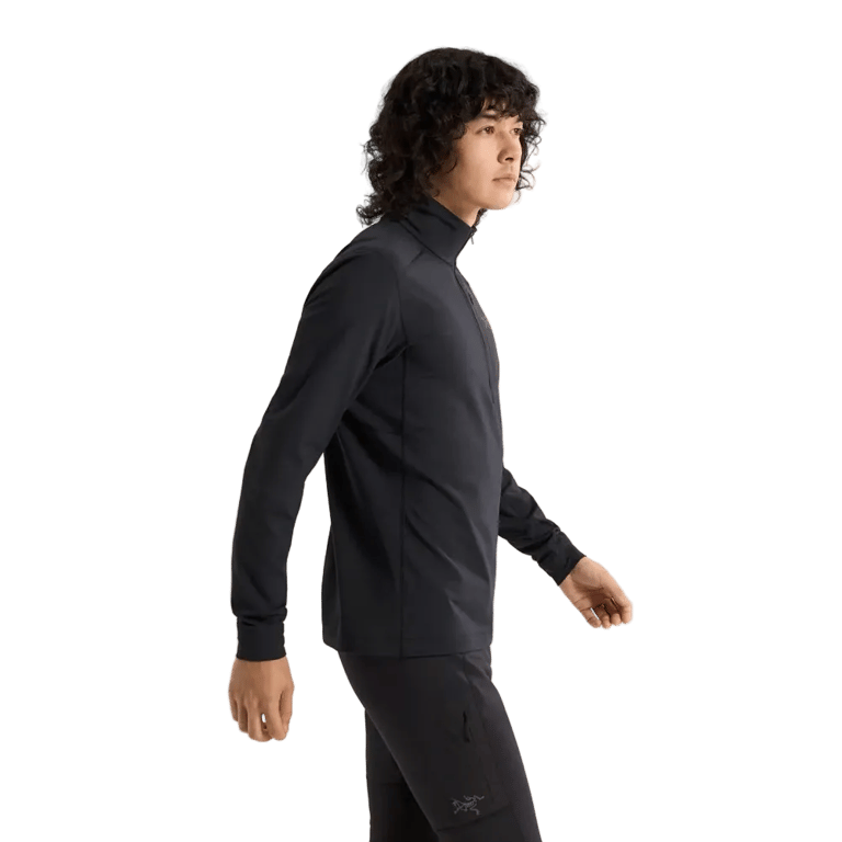 Cropped side view of a man wearing the Arcteryx Rho LT Zip Neck in Black