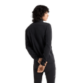 Cropped rear view of a man wearing the Arcteryx Rho LT Zip Neck in Black