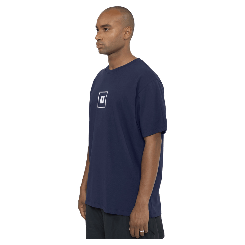 Side view of the Armada Icon Tee in Navy colourway, unisex's model