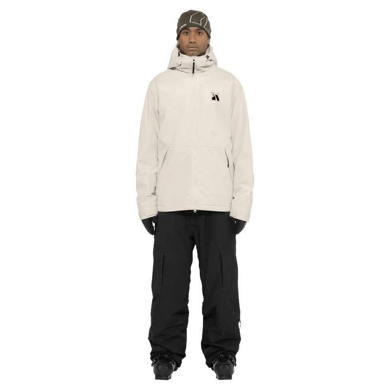 Full-body view of the Armada Reedy 2L Jacket in Cream colourway, men's model