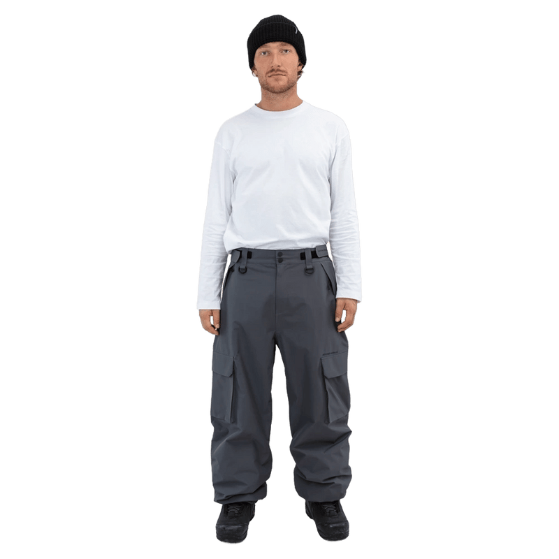 Dark grey Beyond Medals Cargo 2L Snowboard Pants with large side pockets and a relaxed fit on a male model.