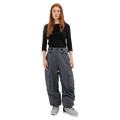 Front view of grey Beyond Medals Cargo 2L Snowboard Pants with large side pockets and a baggy fit on a model.