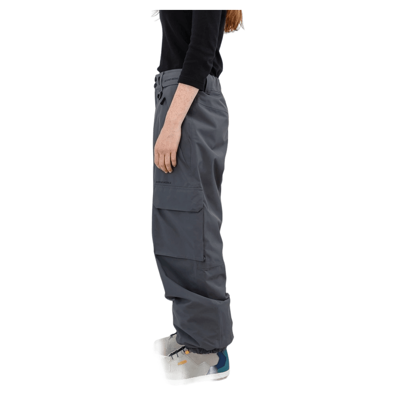 Side profile of grey Beyond Medals Cargo 2L Snowboard Pants featuring a large side cargo pocket and relaxed fit.