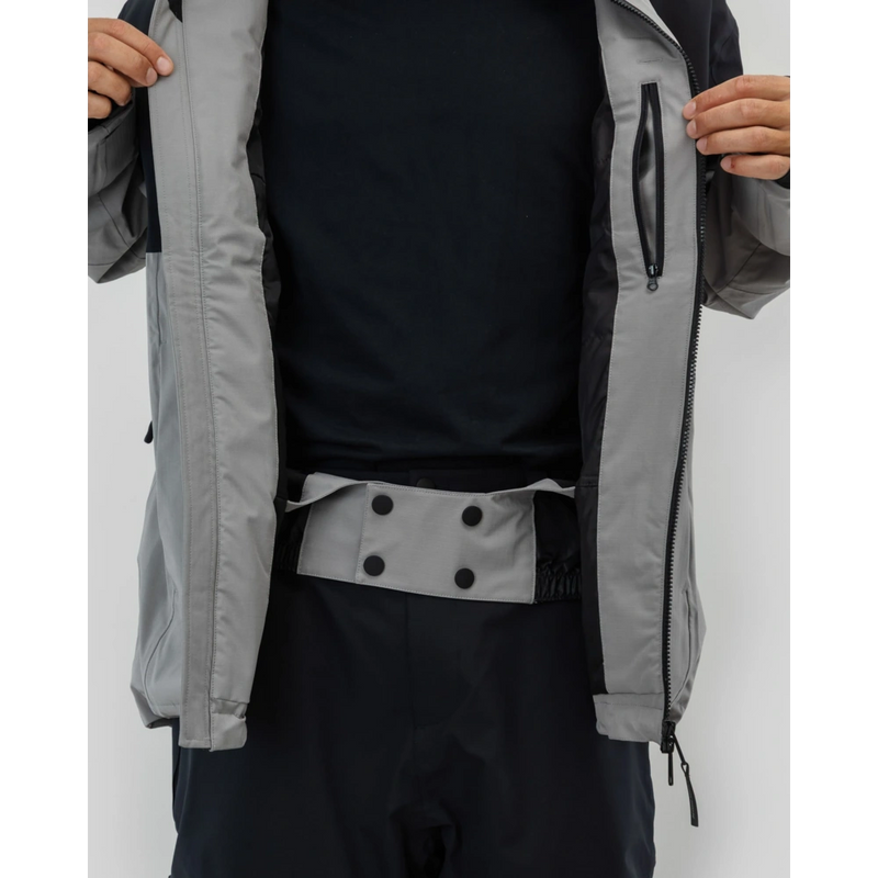 Powder skirt view of the Beyond Medals Fullzip 2L snowboard Jacket in Grey colourway, unisex's model