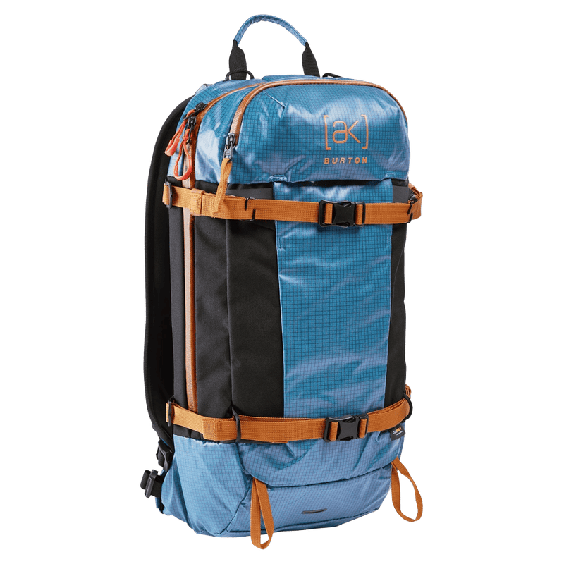 Blue and black Burton AK Dispatcher backcountry backpack with orange compression straps and ripstop fabric.