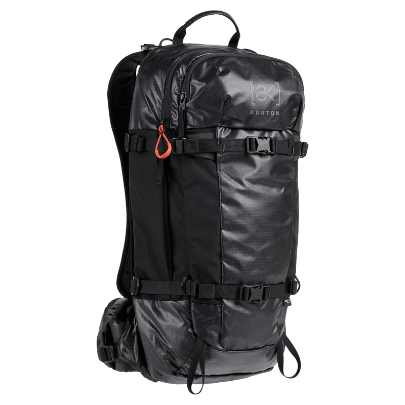 Black Burton AK Dispatcher Backcountry Backpack with shiny technical fabric, compression straps, and orange zipper pull.