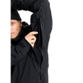 Side view of a black Burton AK Lz Gore-Tex 2L Down Snowboard Jacket showing the underarm zippered pit vent.