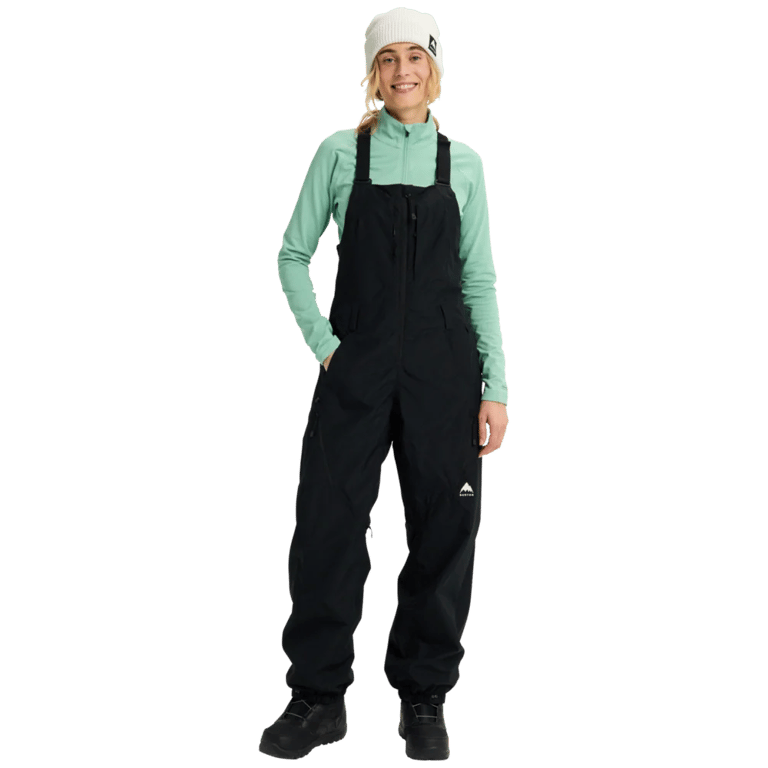 Women's black Burton Reserve Bib Snowboard Pants with front zipper, chest pocket, and white logo on the left leg.