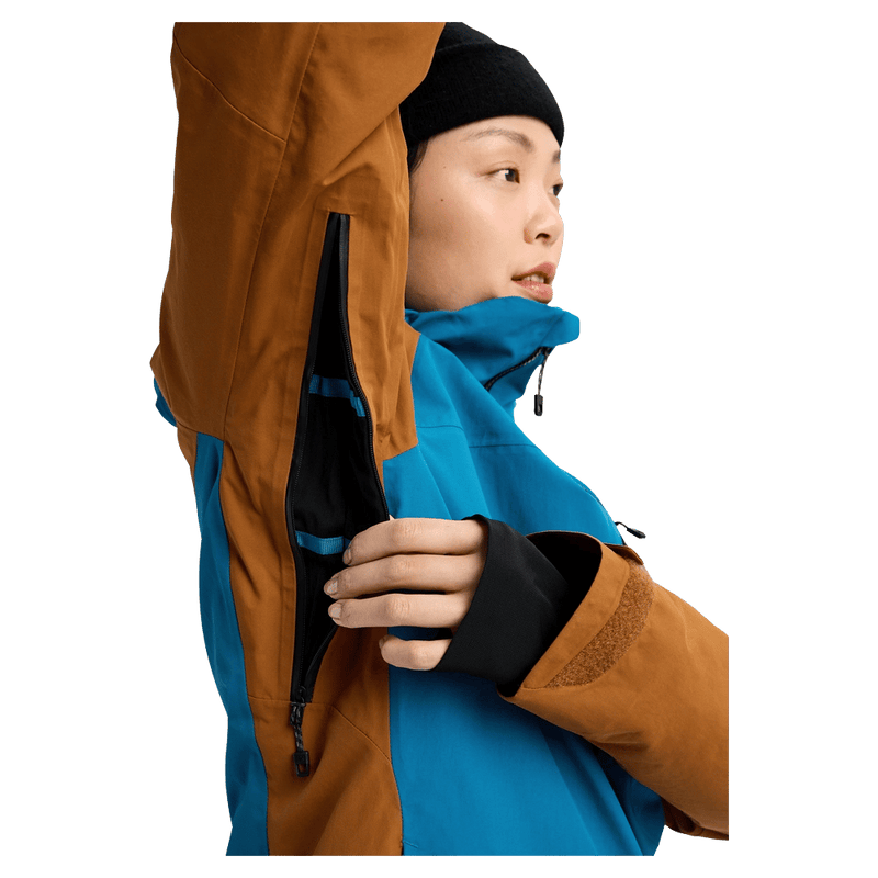 Underarm view of the Burton AK Embark Snowboard Jacket in Blue Teal and Chestnut colourway, women's model