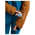 Pass pocket view of the Burton AK Embark Snowboard Jacket in Blue Teal and Chestnut colourway, women's model