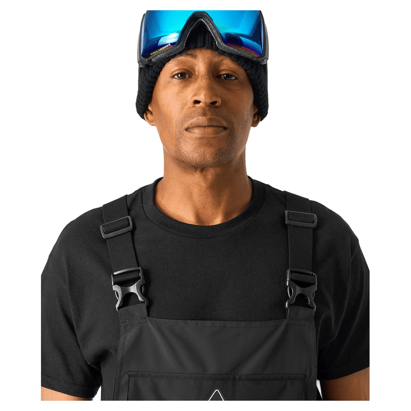 Close view of the DC Brigade BIB in Black colourway, men model