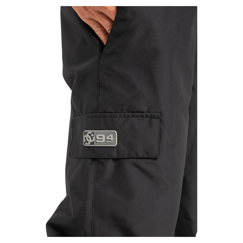 Pocket view of the DC Docile BIB in Black colourway, unisex model