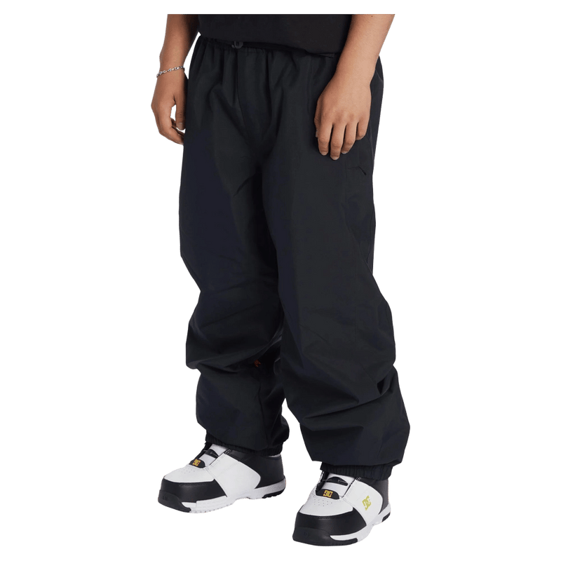 Side view of the DC Primo Pants in Black colourway, men model