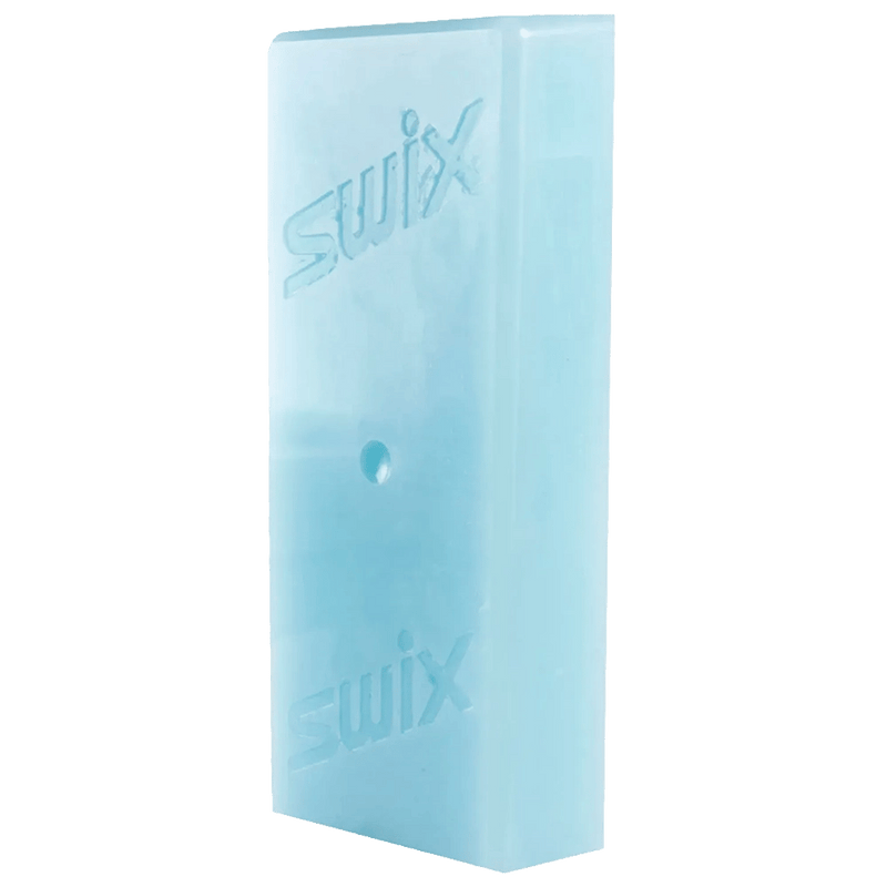 Angled view of a light blue rectangular Swix F4 glidewax block with embossed brand logos.
