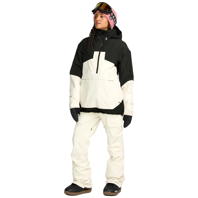 Front, on body image of the Fern Ins Gore Pullover Snowboard Jacket - Womens in Bone. Featuring contrast black across the shoulders, upper arm, and hemline, quarter zip and pouch pocket with flap. 