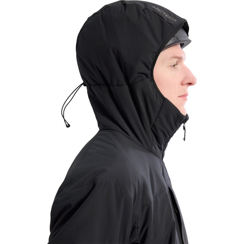 Man wearing the Arcteryx Proton Hoodie in Black shoing the adjustable hood