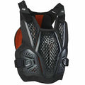 Black Fox Raceframe Impact Guard chest protector with perforated grey panels, orange mesh lining, and white Fox logo.